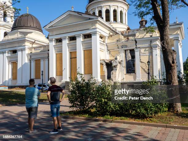 Two men next to the Transfiguration Cathedral on August 27, 2023 in Odessa, Ukraine. In the early hours of July 23, a Russian missile strike, which...
