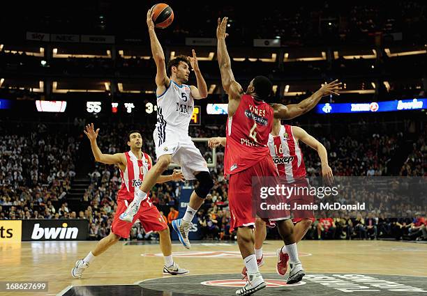 Rudy Fernandez of Real Madrid tussles with Kyle Hines of Olympiacos Piraeus during the Turkish Airlines EuroLeague Final Four final between...