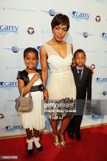 Angela Bassett and children attend the CARRY Foundation's 7th Annual "Shall We Dance" Gala at The Beverly Hilton Hotel on May 11, 2013 in Beverly...