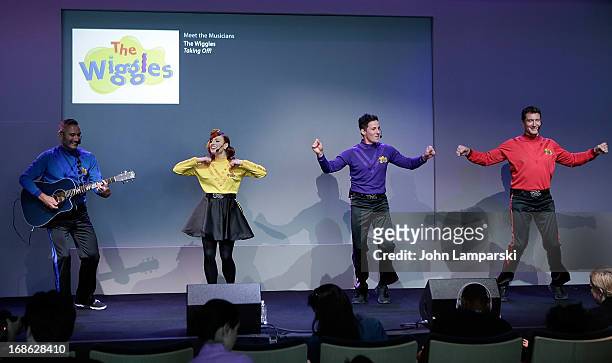 Anthony Field , Emma Watkins, Lachlan Gillespie and Simon Pryce of the Wiggles perform at the Apple Store Soho on May 12, 2013 in New York City.