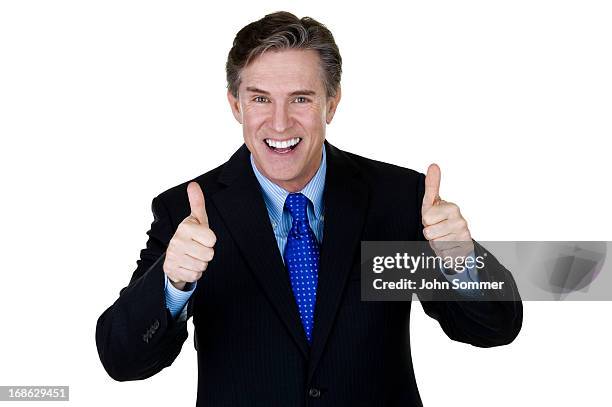 excited businessman gesturing thumbs up - cheesy salesman stockfoto's en -beelden