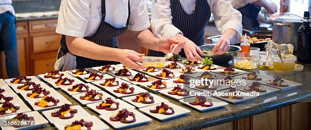 chef's dishing up - banquet stock pictures, royalty-free photos & images