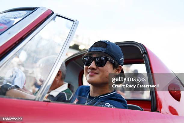 Yuki Tsunoda of Japan and Scuderia AlphaTauri looks on from the drivers parade prior to the F1 Grand Prix of Singapore at Marina Bay Street Circuit...