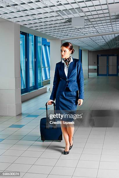beautiful air stewardess - business woman suitcase stockfoto's en -beelden