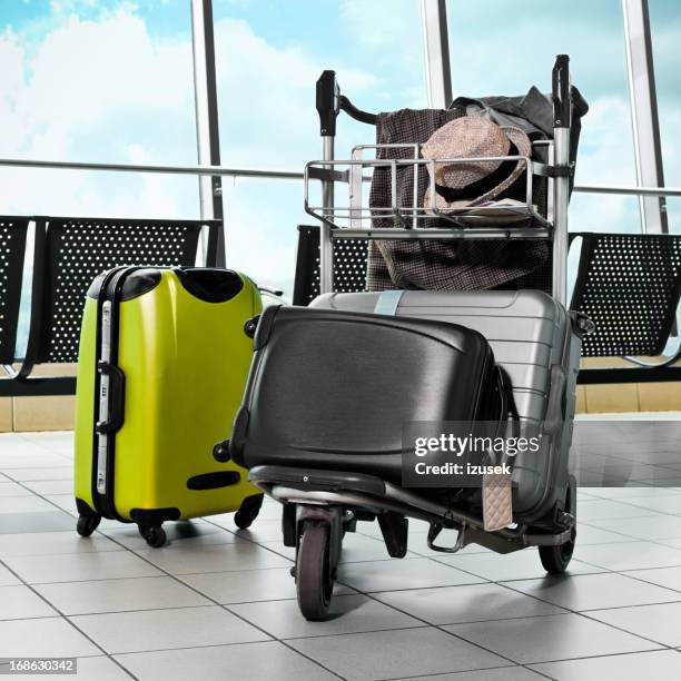 luggage trolley with suitcases - luggage trolley stockfoto's en -beelden