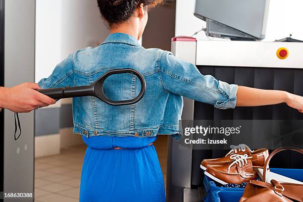 at the airport security check - metal detector security stock pictures, royalty-free photos & images