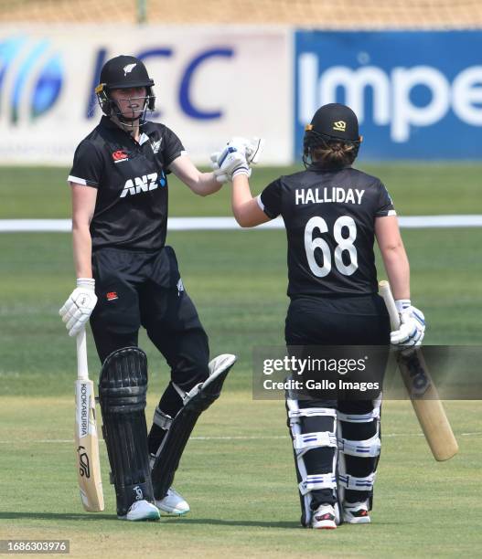 Hannah Rowe and Brooke Halliday of NZ celebrate their 100 runs partnership during the ICC Women's Championship, 1st ODI match between South Africa...