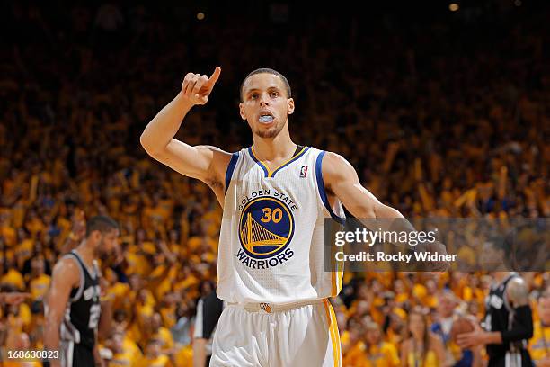 Stephen Curry of the Golden State Warriors celebrates while facing the San Antonio Spurs in Game Four of the Western Conference Semifinals during the...