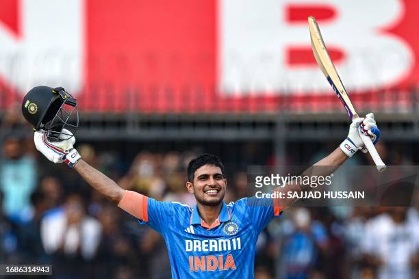 India's Shubman Gill celebrates after scoring a century during the second one-day international cricket match between India and Australia at the...