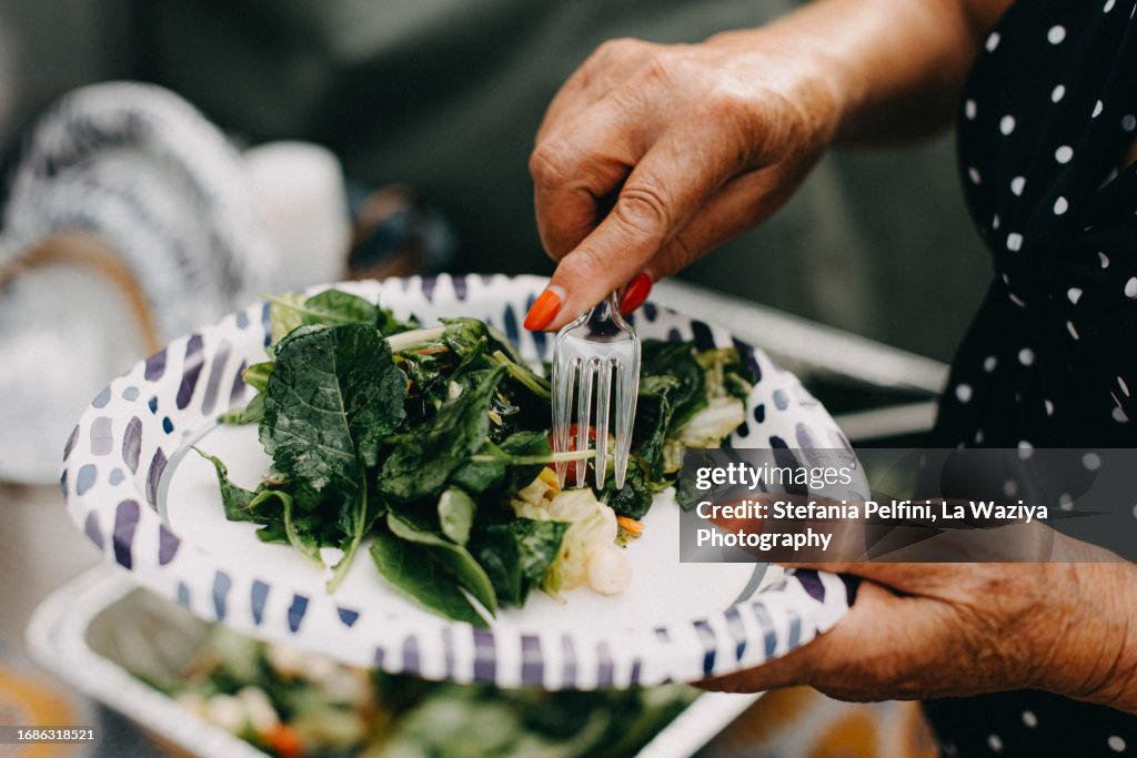 One Senior Woman Eating Salad