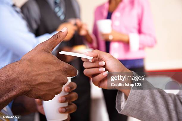 multi ethnic business card exchange social with refreshments - passes stock pictures, royalty-free photos & images