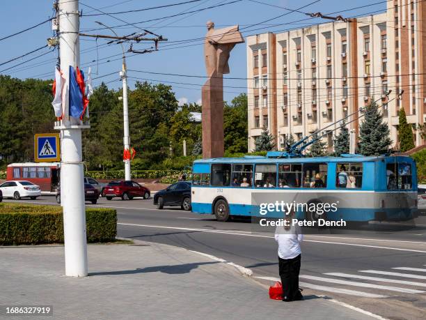 Statue of Vladimir Lenin dominates the area in front of the building of the Transnistria Parliament, a 7-storey central structure connected to two...