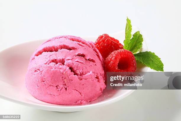 scoop of raspberry icecream on a plate - sorbet isolated stock pictures, royalty-free photos & images