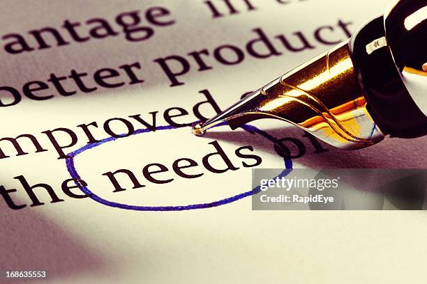 fountain pen circles the word &quot;needs&quot; in business document - needs improvement stock pictures, royalty-free photos & images