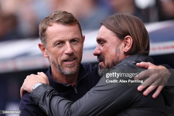 Gary Rowett, Manager of Millwall, and Daniel Farke, Manager of Leeds United, embrace prior to the Sky Bet Championship match between Millwall and...