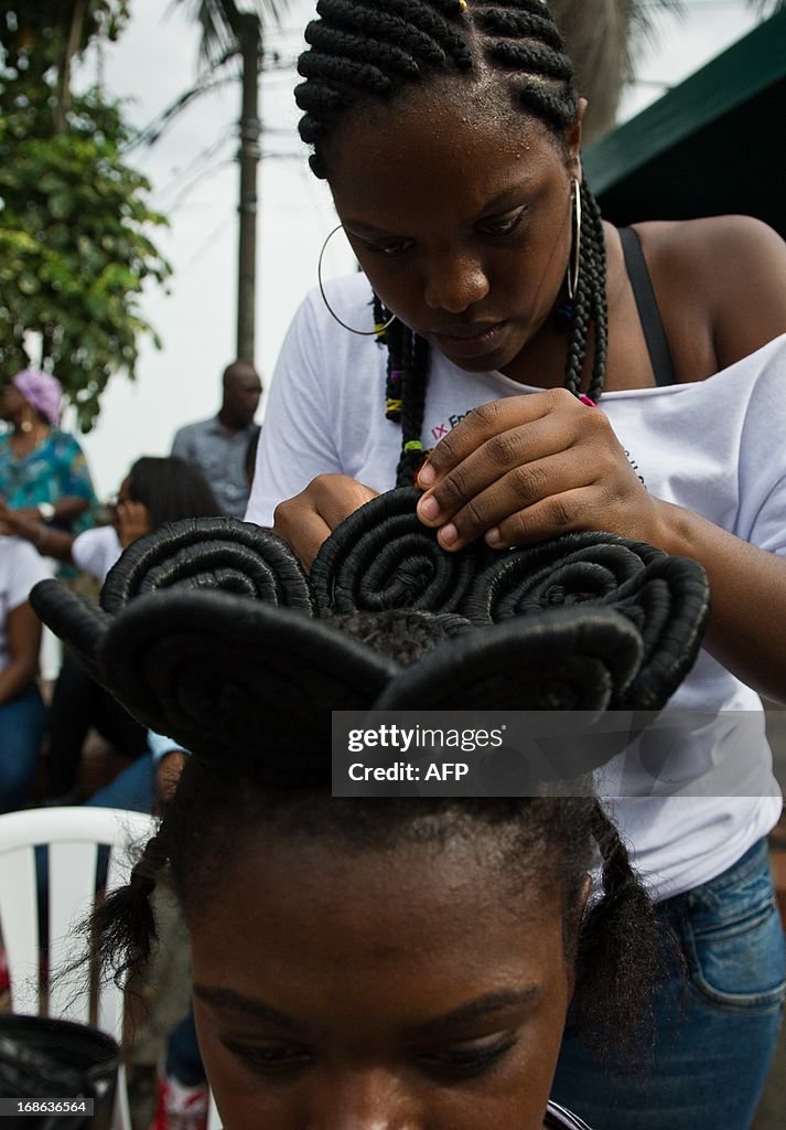 A woman gets an Afro-Colombian hairstyle during the 9th contest of... News  Photo - Getty Images