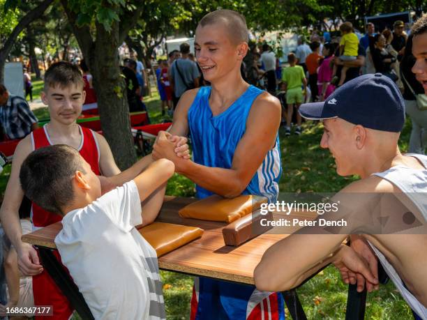 Boys arm wrestle in De Wollant Park on Republic Day on September 2, 2023 in Tiraspol, Moldova . Tiraspol is the capital of Transnistria situated on...