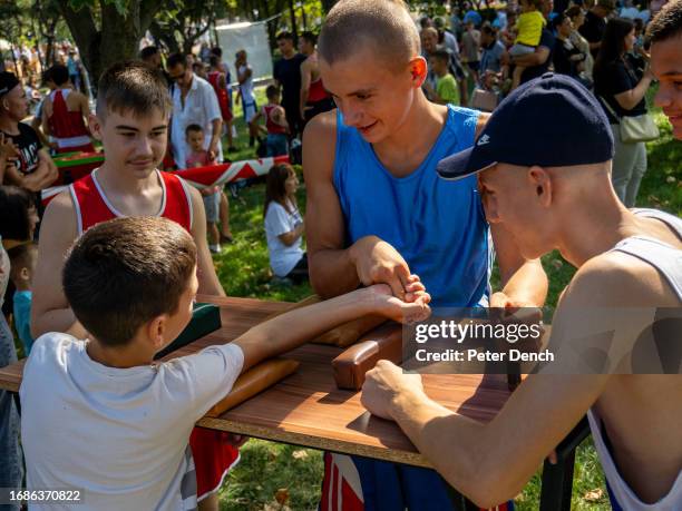 Boys arm wrestle in De Wollant Park on Republic Day on September 2, 2023 in Tiraspol, Moldova . Tiraspol is the capital of Transnistria situated on...