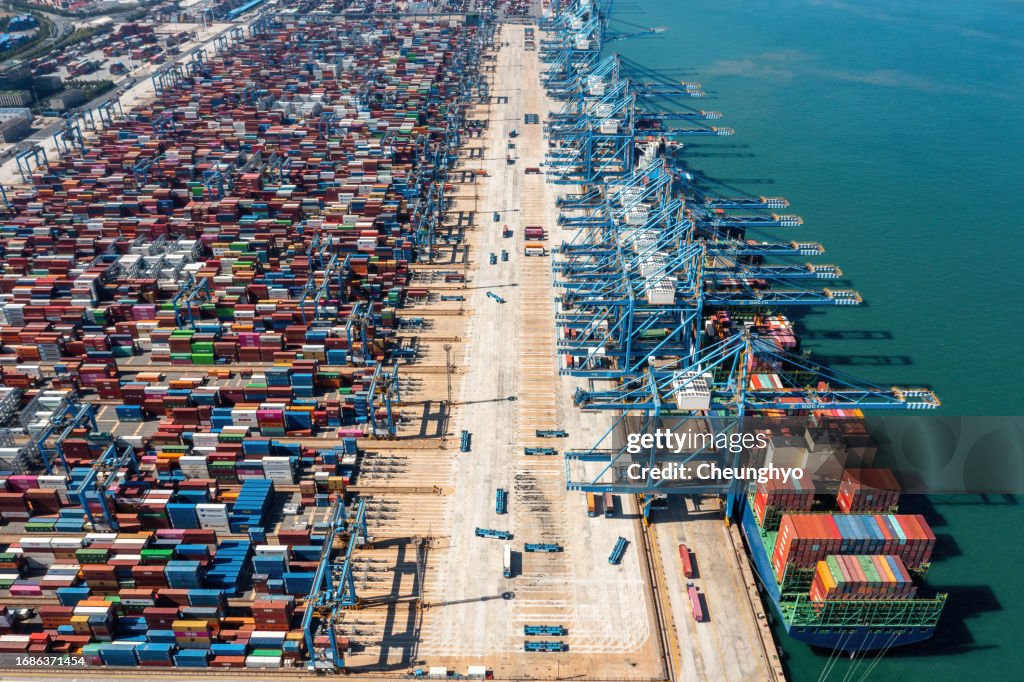 Aerial View Container Cargo Ship on Terminal Commercial Port, Business Logistic and Transportation Industry in Qingdao City, Shandong Province, China