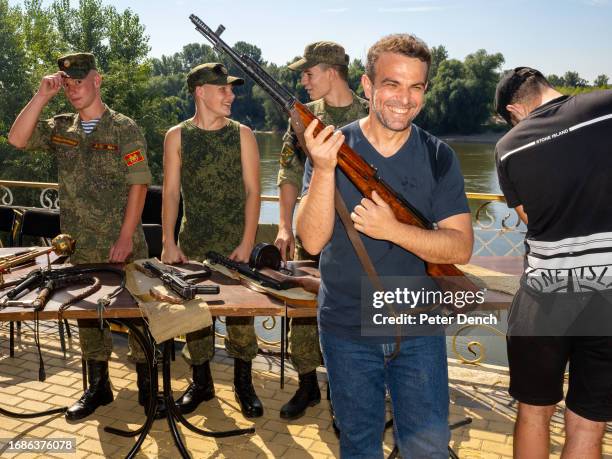 Man poses with a weapon, part of Republic Day events and celebrations on September 2, 2023 in Tiraspol, Moldova . Tiraspol is the capital of...