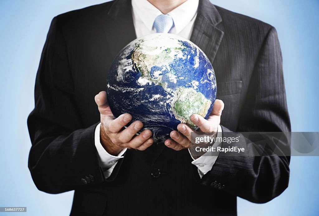 Cropped image with businessman holding satellite view of Earth