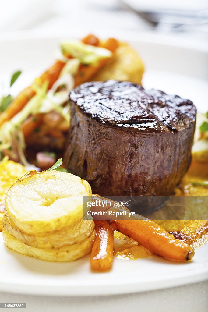 High-angle view of restaurant style steak and vegetables