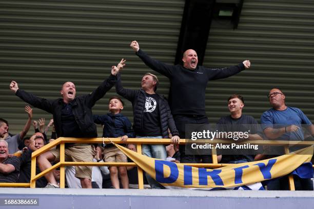 Fans of Leeds United react during the Sky Bet Championship match between Millwall and Leeds United at The Den on September 17, 2023 in London,...