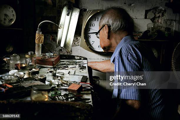 old clock-smith - clock repair stock pictures, royalty-free photos & images