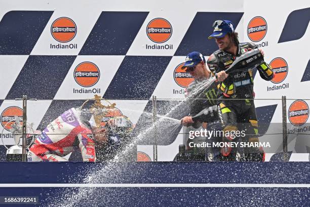 First placed Mooney VR46 Racing Team's Italian rider Marco Bezzecchi , second placed Prima Pramac Racing's Spanish rider Jorge Martin and third...