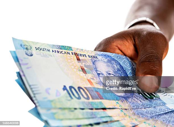 männliche hand hält sie warm von banknoten hundert rand - south african currency stock-fotos und bilder