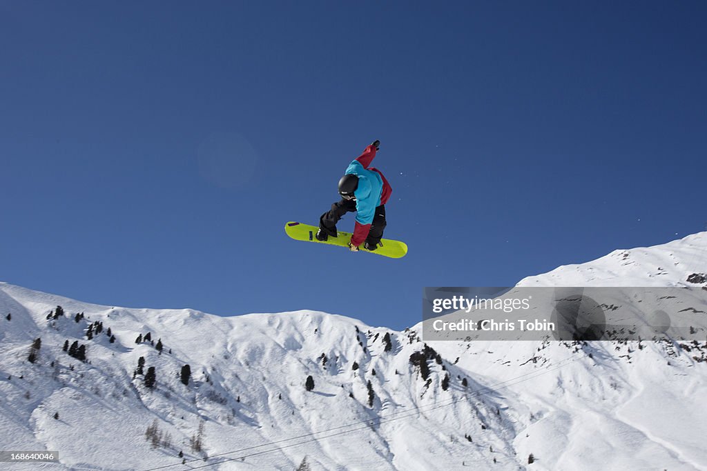 Snowboarder doing a jump