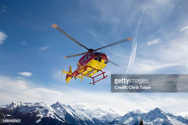 helicopter in the mountains - rescuers stock pictures, royalty-free photos & images
