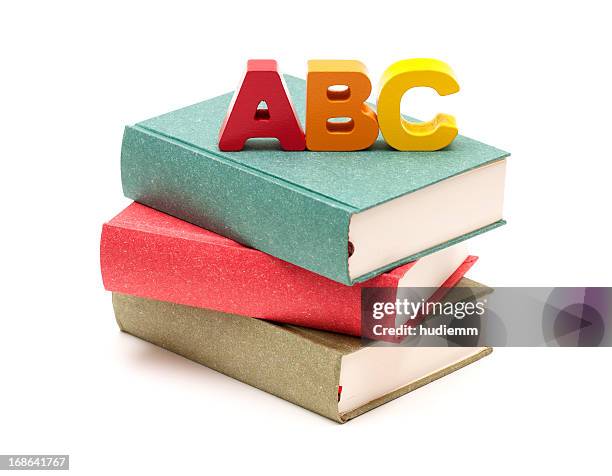 school books and alphabet isolated on white background - slab white background stock pictures, royalty-free photos & images