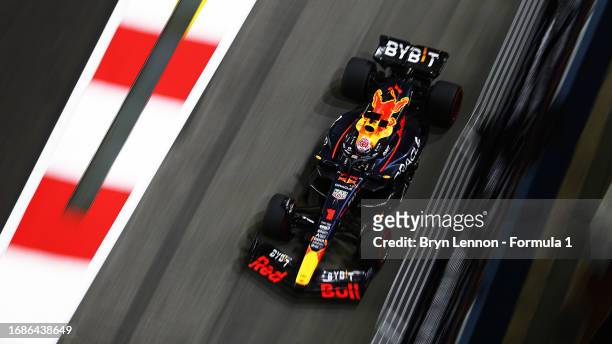 Max Verstappen of the Netherlands driving the Oracle Red Bull Racing RB19 on his way to the grid prior to the F1 Grand Prix of Singapore at Marina...