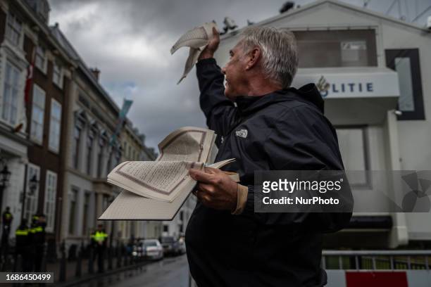 Edwin Wagensveld tears up the Koran in front of the Turkisch Embassy in The Hague, Netherlands, on September 24, 2023. Anti-Islam movement Pegida...