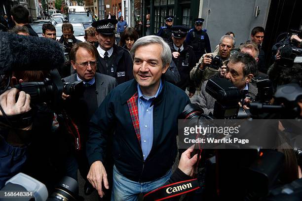 Chris Huhne is surrounded by media as he arrives home after being released from prison on May 13, 2013 in Gloucester, England. The former energy...