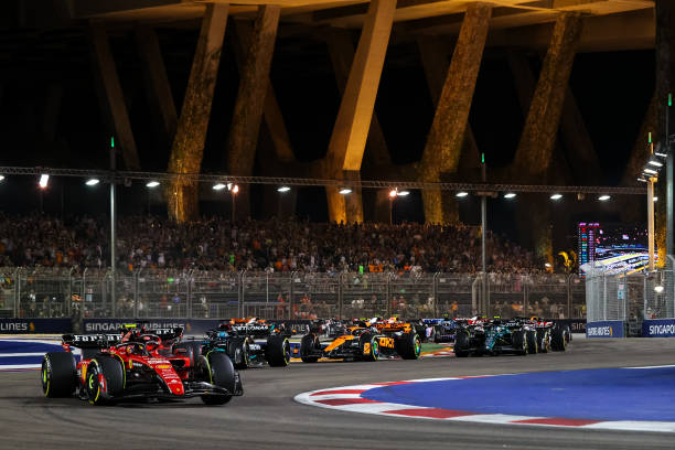 F1 Grand Prix of SingaporeSINGAPORE, SINGAPORE - SEPTEMBER 17: Carlos Sainz of Spain and Ferrari drives in front of the field during the start of the Singapore Formula One Grand Prix night race at Marina Bay Street Circuit on September 17, 2023 in Singapore, Singapore.