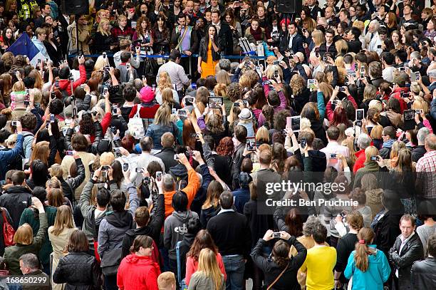 Laura Wright attends a singing flashmob of songs from Les Miserables at St Pancras Station on May 13, 2013 in London, England.