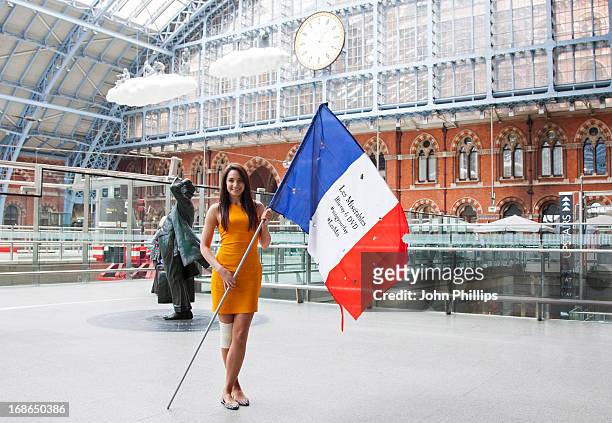 Laura Wright attends a singing flashmob of songs from Les Miserables at St Pancras Station on May 13, 2013 in London, England.