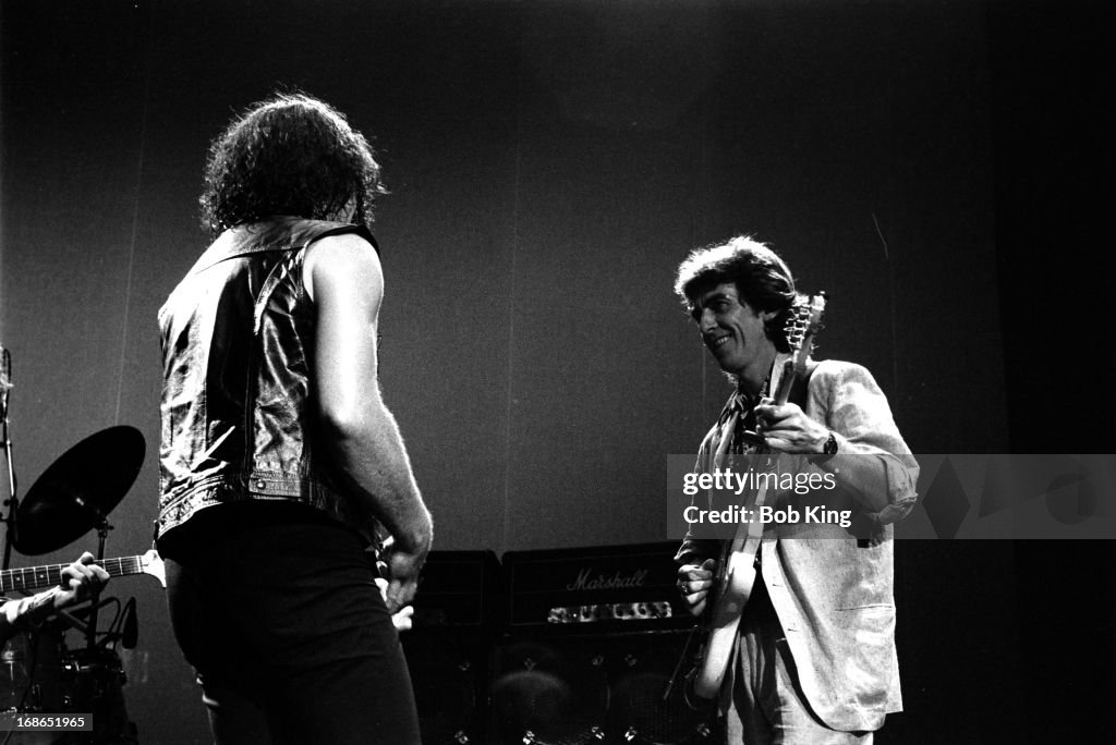 Ian Gillan of Deep Purple performs on stage with George Harrison on ...