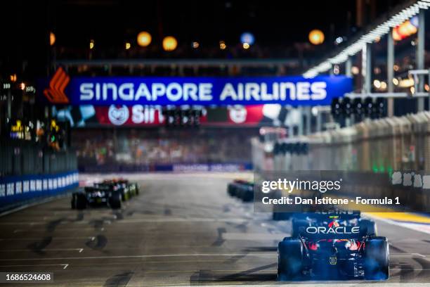 Sergio Perez of Mexico driving the Oracle Red Bull Racing RB19 makes his way to the grid at the end of the formation lap during the F1 Grand Prix of...