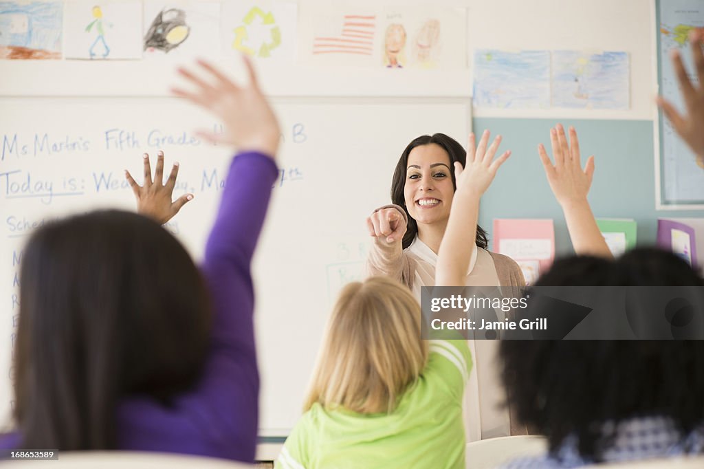 Teacher Calling On Student In Classroom High-Res Stock Photo - Getty Images