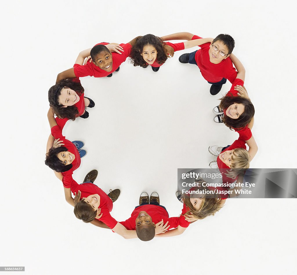 Aerial view of smiling children in a circle