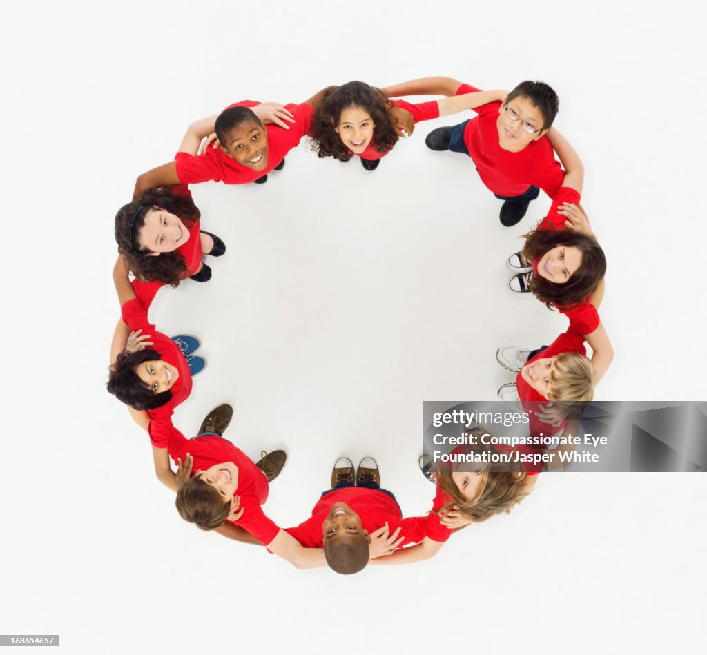 Aerial view of smiling children in a circle