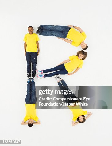 Children Laying In Letter R Formation High-Res Stock Photo - Getty Images