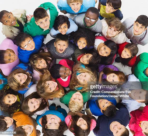 aerial view of group of smiling children - kids smiling multiple nationalities stock pictures, royalty-free photos & images
