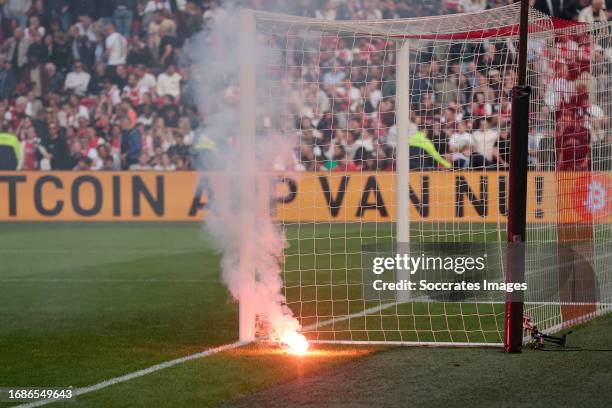 Fireworks thrown on the pitch by supporters of Ajax after the 0-3 during the Dutch Eredivisie match between Ajax v Feyenoord at the Johan Cruijff...