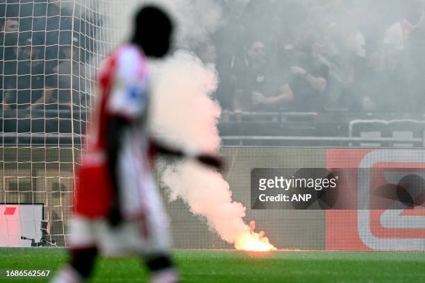 Ajax supporters throw fireworks on the field during the Dutch Eredivisie match between Ajax and Feyenoord at the Johan Cruijff ArenA on September 24,...