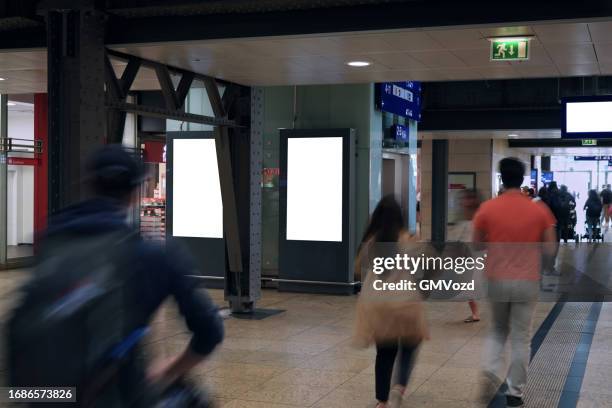 digital billboard at train station - pedestrian zone stock pictures, royalty-free photos & images
