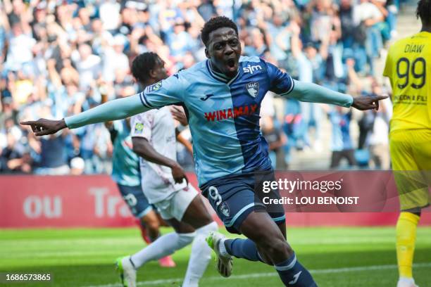 Le Havre's French-Guinean forward Mohamed Bayo celebrates scoring his team's second goal during the French L1 football match between Le Havre AC and...